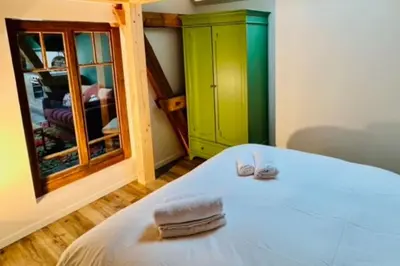 Un ou plusieurs lits dans un hébergement de l'établissement La Rose des Vents - Appartement avec Terrasse, Piscine et Parking