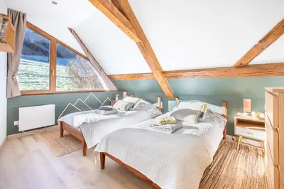 Un ou plusieurs lits dans un hébergement de l'établissement Le gîte de la Grande Vallée - Vue exceptionnelle
