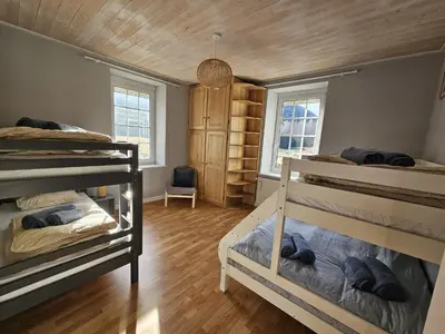 Un ou plusieurs lits dans un hébergement de l'établissement Maison Le Beauregard Bussang