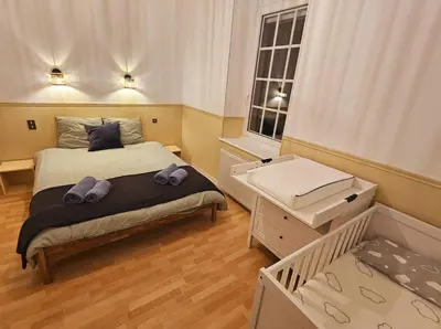 Un ou plusieurs lits dans un hébergement de l'établissement Maison Le Beauregard Bussang