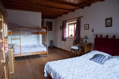 Un ou plusieurs lits dans un hébergement de l'établissement Gîte du Pré au Miel en plein coeur de l'Alsace