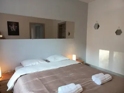 Un ou plusieurs lits dans un hébergement de l'établissement Appartement Les Iris, au calme, proche du centre