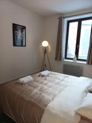 Un ou plusieurs lits dans un hébergement de l'établissement Appartement Les Iris, au calme, proche du centre