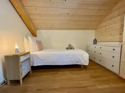 Un ou plusieurs lits dans un hébergement de l'établissement CHALET LES 2 MARMOTTES 4 étoiles Bain nordique, Pétanque