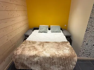 Un ou plusieurs lits dans un hébergement de l'établissement CHALET LES 2 MARMOTTES 4 étoiles Bain nordique, Pétanque