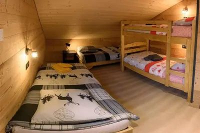 Un ou plusieurs lits dans un hébergement de l'établissement Chalet cosy 4 étoiles le Domaine Des Mésanges