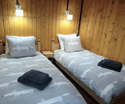 Un ou plusieurs lits dans un hébergement de l'établissement Chalet Pura Vida - En pleine nature, tout confort
