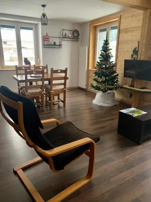 Coin salon dans l'établissement Appartement cosy avec jardin et barbecue