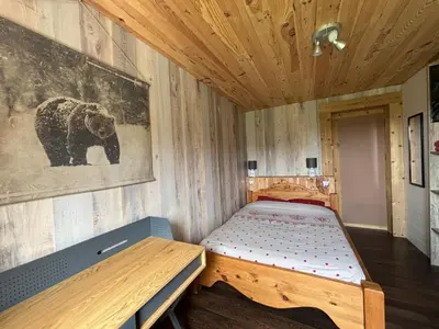 Un ou plusieurs lits dans un hébergement de l'établissement Appartement cosy avec jardin et barbecue