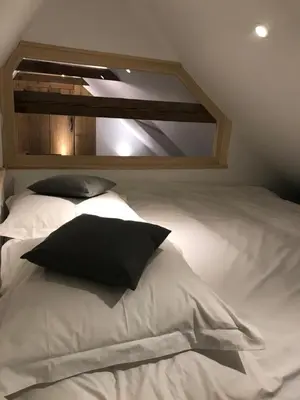 Un ou plusieurs lits dans un hébergement de l'établissement Chabi Chalet Gîte au coeur d'Eguisheim