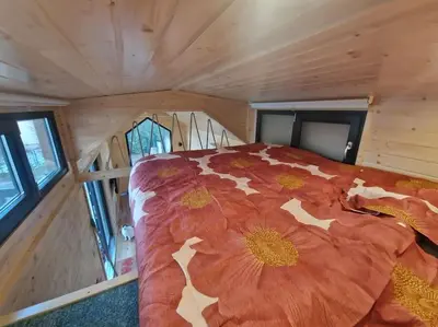 Un ou plusieurs lits dans un hébergement de l'établissement Magnifique petite maison