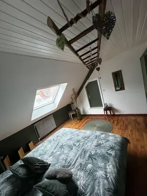 Un ou plusieurs lits dans un hébergement de l'établissement Appartement Love à Lauw