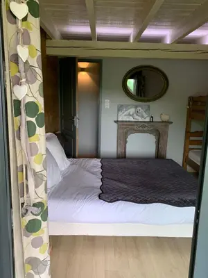 Un ou plusieurs lits dans un hébergement de l'établissement Le Chalet de Juliette