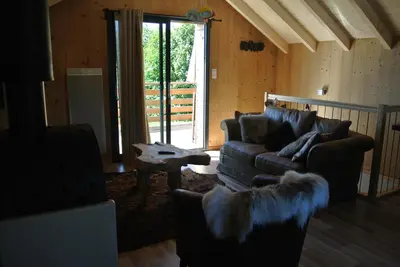 Coin salon dans l'établissement Le Chalet de Juliette