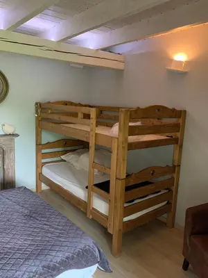 Un ou plusieurs lits dans un hébergement de l'établissement Le Chalet de Juliette