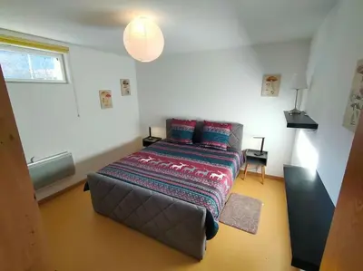 Un ou plusieurs lits dans un hébergement de l'établissement Industriel F3 Appartement