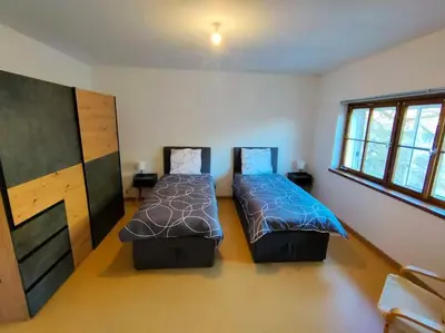 Un ou plusieurs lits dans un hébergement de l'établissement Industriel F3 Appartement