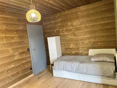 Un ou plusieurs lits dans un hébergement de l'établissement Chalet PRALIN