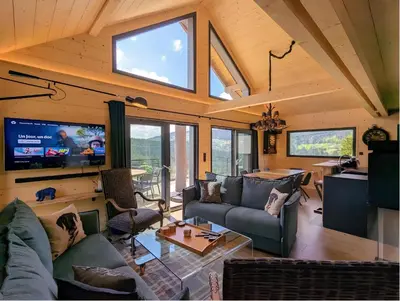 Télévision ou salle de divertissement dans l'établissement Chalet l'URSUS - séjour premium avec vue montagne