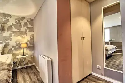 Un ou plusieurs lits dans un hébergement de l'établissement La Grande Ourse - Chambre cosy 2 pers - L'Alcôve de l'Ours