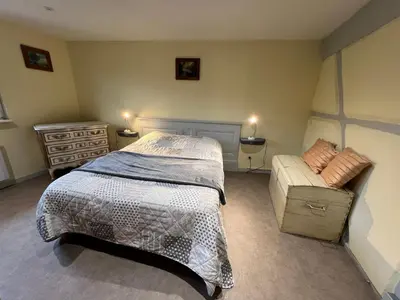 Un ou plusieurs lits dans un hébergement de l'établissement Maison chez Léa - grand gîte familial calme parking terrasse