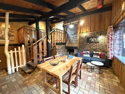 Coin salon dans l'établissement LA POMME DE PIN 1 Appartement avec terrasse