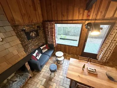 Coin salon dans l'établissement LA POMME DE PIN 1 Appartement avec terrasse