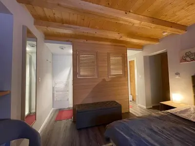 Un ou plusieurs lits dans un hébergement de l'établissement Le Repaire de l'Ours - L'Alcôve de l'Ours - Chambre cosy 2 pers