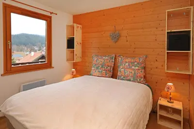 Un ou plusieurs lits dans un hébergement de l'établissement Le Chalet du Lac - Dans un environnement idéal