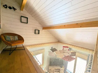 Coin salon dans l'établissement Chalet Sauna jacuzzi 6 personnes