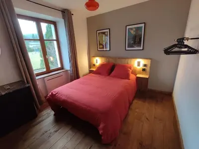 Un ou plusieurs lits dans un hébergement de l'établissement Logement Spacieux
