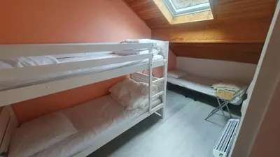 Un ou plusieurs lits dans un hébergement de l'établissement GITE LE HOLWECK Gérardmer
