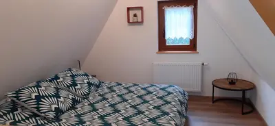 Un ou plusieurs lits dans un hébergement de l'établissement Coup de cœur en Alsace ! Proche Colmar et sur la route des Vins, Gîte de la Muse avec son jardin