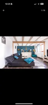 Coin salon dans l'établissement Gîte Chez l'Oncle Paul