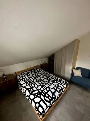Un ou plusieurs lits dans un hébergement de l'établissement Studio tout équipé aux pieds des Vosges