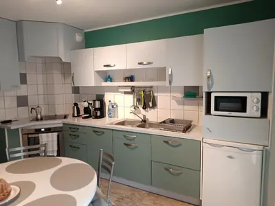Cuisine ou kitchenette dans l'établissement LE 46A