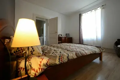 Un ou plusieurs lits dans un hébergement de l'établissement Appartement de caractère