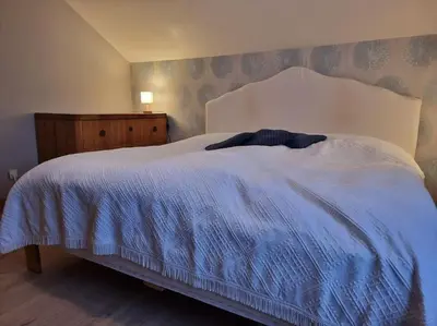 Un ou plusieurs lits dans un hébergement de l'établissement La Maison Chamarrée