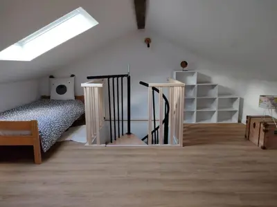 Un ou plusieurs lits dans un hébergement de l'établissement Appartement chaleureux au pied des pistes