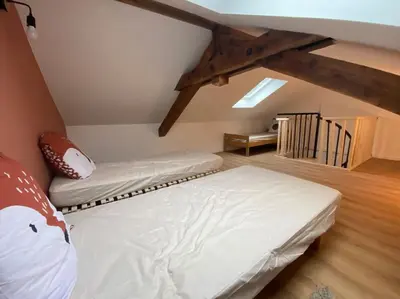 Un ou plusieurs lits dans un hébergement de l'établissement Appartement chaleureux au pied des pistes
