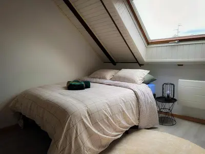 Un ou plusieurs lits dans un hébergement de l'établissement Spacieux Appartement 3 chambres Cosy
