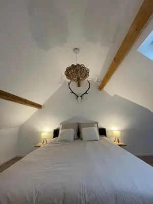 Un ou plusieurs lits dans un hébergement de l'établissement Beau duplex vue sur le Lac Blanc