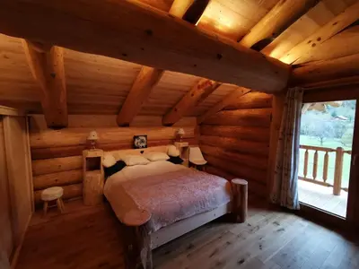 Un ou plusieurs lits dans un hébergement de l'établissement Chalet 10 pers sauna & SPA La tanière des Vosges