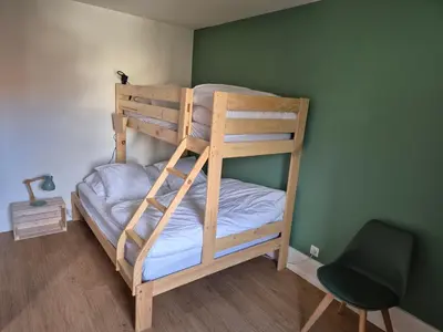 Un ou plusieurs lits dans un hébergement de l'établissement L’appart Les p’tits Loups