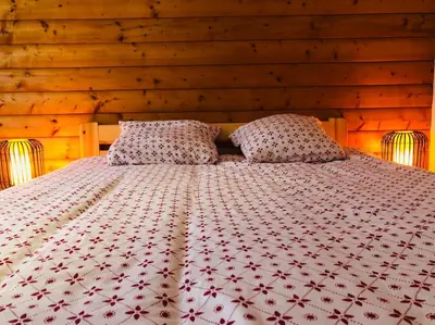 Un ou plusieurs lits dans un hébergement de l'établissement Chalet à Gérardmer - Vue montagne - Calme & Paisible
