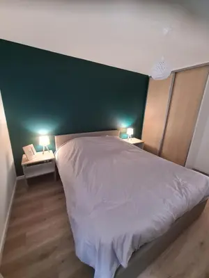 Un ou plusieurs lits dans un hébergement de l'établissement Appartement au pied des pistes avec grande terrasse