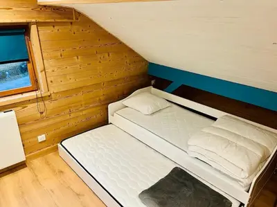 Un ou plusieurs lits dans un hébergement de l'établissement Appartement La Galerie de Mémé