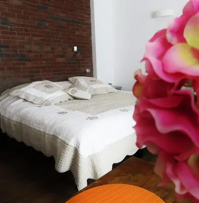Un ou plusieurs lits dans un hébergement de l'établissement Guesthouse Le Vauban