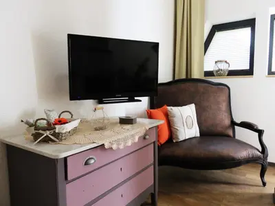 Télévision ou salle de divertissement dans l'établissement Guesthouse Le Vauban