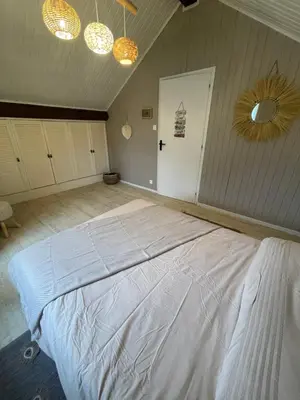 Un ou plusieurs lits dans un hébergement de l'établissement L appartement chez J&C